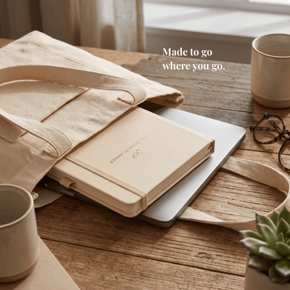 The Deen Planner tucked inside a canvas tote bag next to a laptop